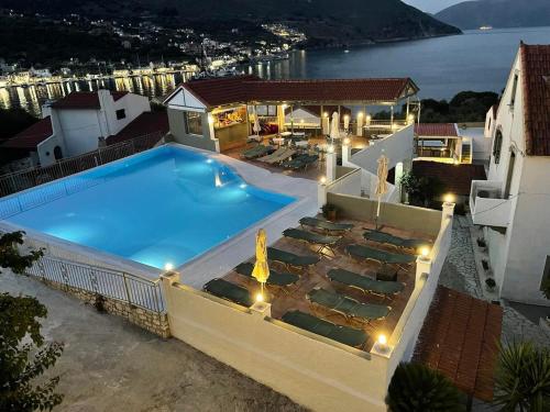a large swimming pool on top of a building at MAKIS VILLAGE-APARTMENTS in Ayia Evfimia