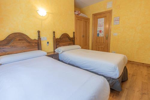 Ένα ή περισσότερα κρεβάτια σε δωμάτιο στο HOSTAL RIO ARA BELLOSTA by Vivere Stays