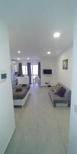 Χώρος καθιστικού στο Wonderful apartments with shared jacuzzi and panorama rooftop