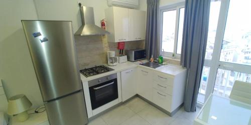 Η κουζίνα ή μικρή κουζίνα στο Wonderful apartments with shared jacuzzi and panorama rooftop