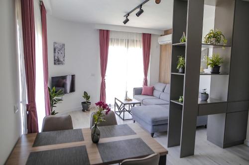 a living room with a couch and a table at Allure Apartments in Ulcinj