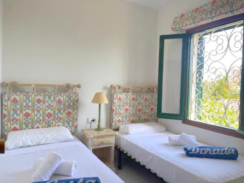 A bed or beds in a room at MILA adosado vistas al mar