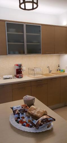 a kitchen with a table with food on a counter at Δροσιά in Nafplio