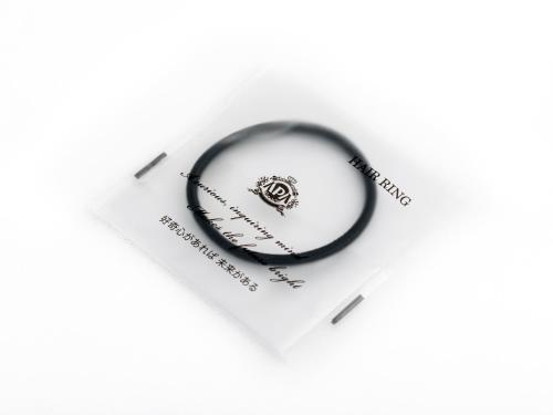 a white envelope with a black ring on it at APA Hotel Asakusa Kuramae Ekimae in Tokyo
