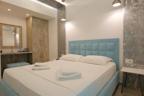 Postel nebo postele na pokoji v ubytování Kuburi Hotel