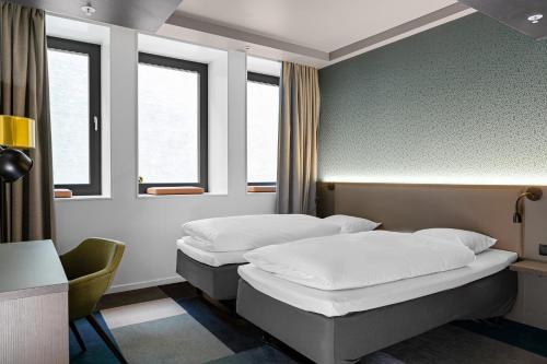 En eller flere senge i et værelse på Comfort Hotel Xpress Central Station