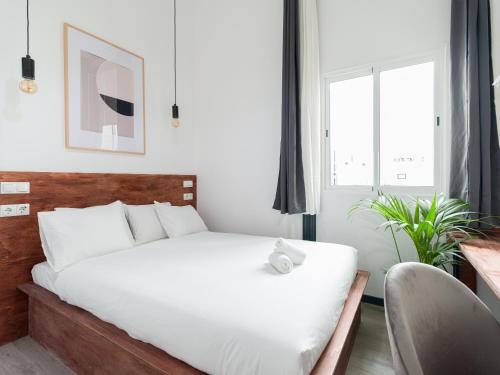 Кровать или кровати в номере Columbus Rooftop Hostel