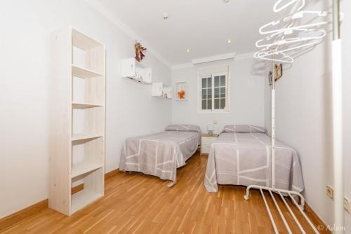Posteľ alebo postele v izbe v ubytovaní Precioso apartamento en Málaga al lado de la playa