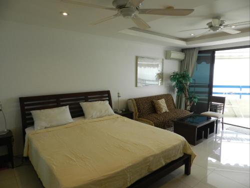 En eller flere senge i et værelse på Jomtien PLAZA Condotel