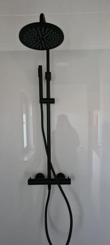 a black stand with a hat on top of it at Spelver95 in Bilzen