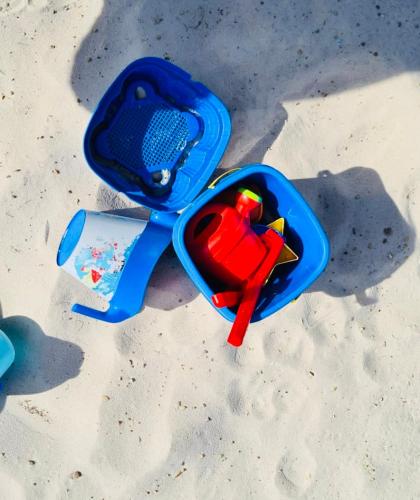 a childs toy in the sand on the beach at Spelver95 in Bilzen