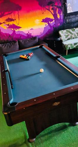 a pool table in a living room with afits at Spelver95 in Bilzen