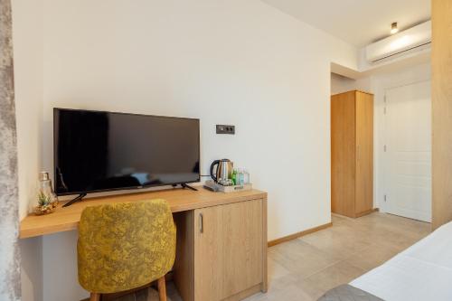 TV a/nebo společenská místnost v ubytování SkyView apartments