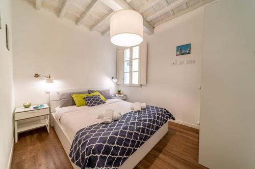 Posteľ alebo postele v izbe v ubytovaní 32 nero - Florence Apartment San Niccolò