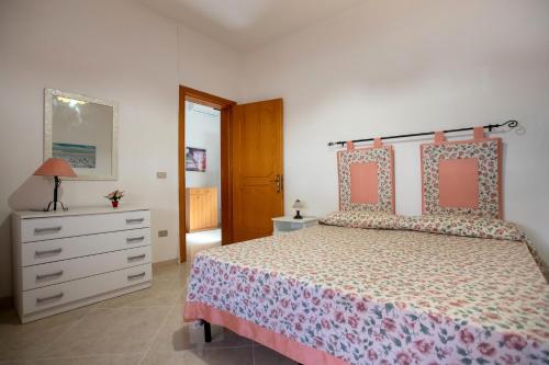 Ένα ή περισσότερα κρεβάτια σε δωμάτιο στο Casa Giardino