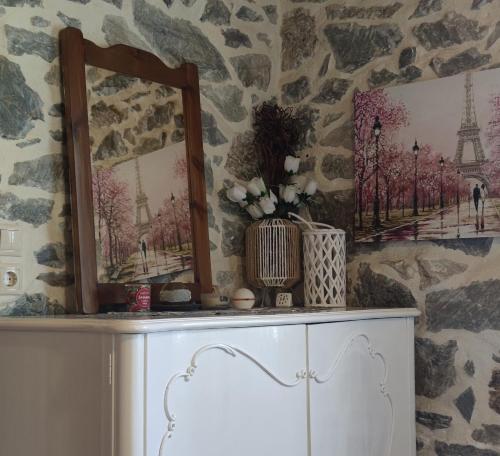 a room with two mirrors on top of a dresser at Marios guesthouse Pelion in Tsagarada