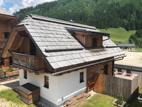 an overhead view of a house with a metal roof at Bergdorf Riesner in Donnersbachwald