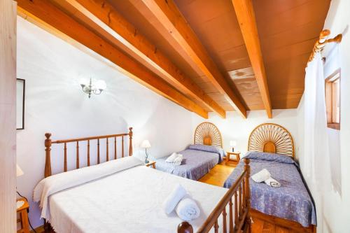 Postel nebo postele na pokoji v ubytování Petita Casa Marinero