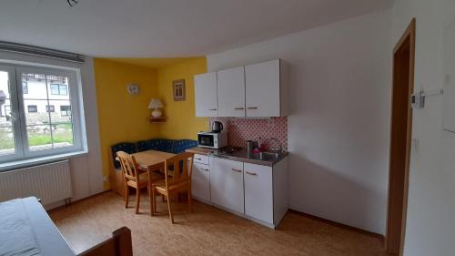 Kuchyň nebo kuchyňský kout v ubytování Apartmán Klondajk Harrachov