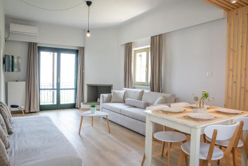 a living room with a couch and a table at Marabou Hotel Chorefto in Chorefto
