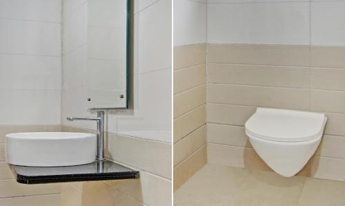 a bathroom with a toilet and a sink at Treebo Villa Inn Aurangabad in Aurangabad