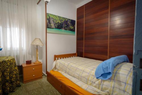 a bedroom with a bed with a wooden headboard at 3 bedrooms villa with private pool furnished terrace and wifi at Vitigudino in Vitigudino