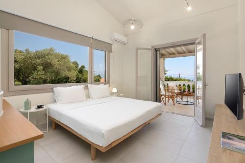 A bed or beds in a room at Ionian Garden Villas - Villa Sol