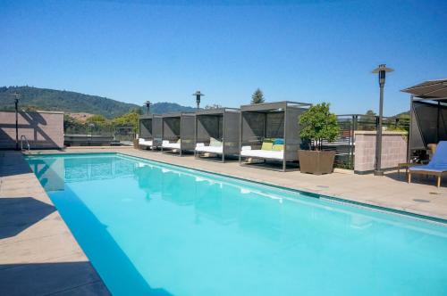 a large swimming pool with a row of tents at Bardessono Hotel and Spa in Yountville