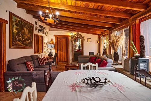 a living room with a table and a couch at Finca OASIS Fataga in Maspalomas
