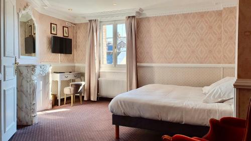 Un pat sau paturi într-o cameră la Les Cabines