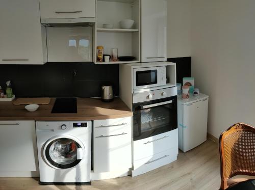 Een keuken of kitchenette bij La sérénité au cœur des montagnes