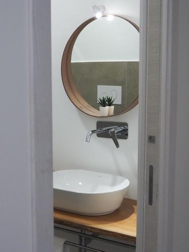 a bathroom with a sink and a mirror at DonPè in Agrigento
