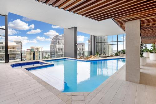 a large swimming pool on the roof of a building at Lamour Ocean View Apartment II in Casino Broadbeach - free parking-195cm in Gold Coast