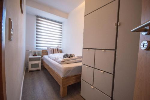 Кровать или кровати в номере Neue-Reihe-8-rechts