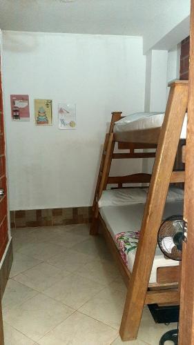 a room with two bunk beds in a room at Cabañas Mar Caribe in Necoclí
