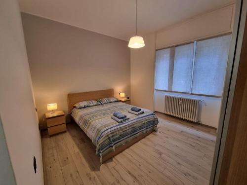 Ένα ή περισσότερα κρεβάτια σε δωμάτιο στο Melaverde flat Milano