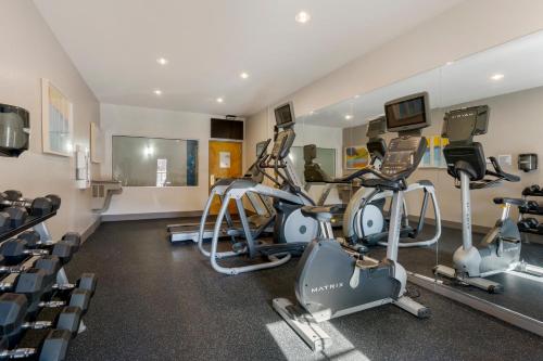 a gym with several treadmills and cardio machines at Holiday Inn Express Hotel & Suites - The Villages by IHG in The Villages
