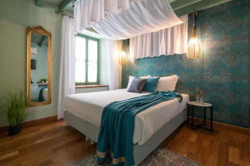 A bed or beds in a room at Sperveri Boutique Hotel