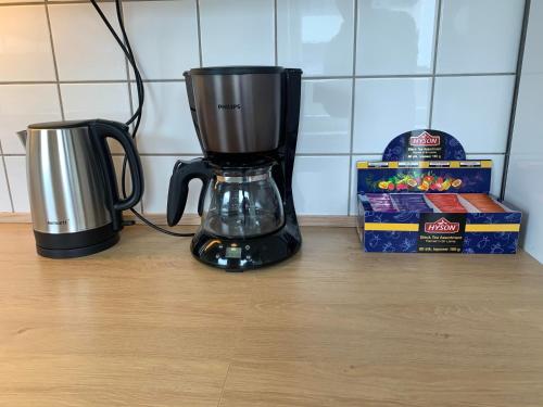 a blender sitting on a counter next to a box of cookies at Notodden Sentrum Apartment NO 7 in Notodden