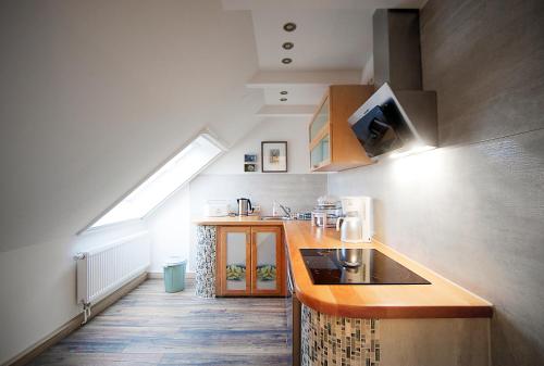 a kitchen with a sink and a counter top at Haus Müritz, 14 Roter Milan in Zielow