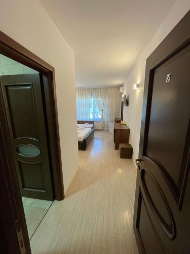 a view of a room with a bed and a door at VILA REGAL Mamaia in Mamaia