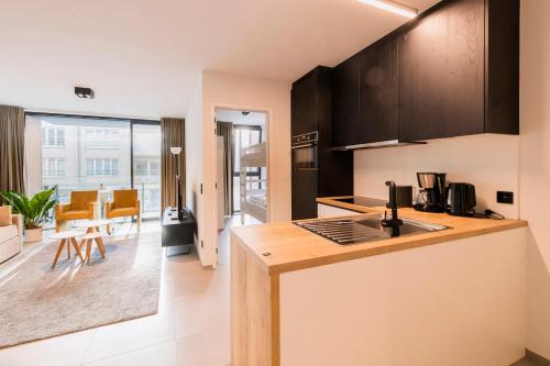 Kuchyň nebo kuchyňský kout v ubytování Belcasa Beach Suites & Lofts
