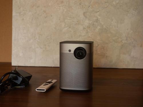 a camera sitting on a table next to a remote control at SUKIYA-zukuri Suehiro in Hida