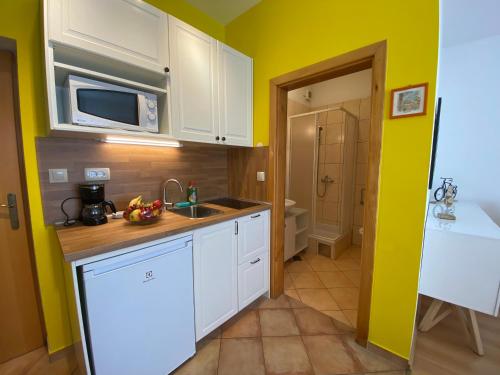 Una cocina o zona de cocina en Apartments A&A