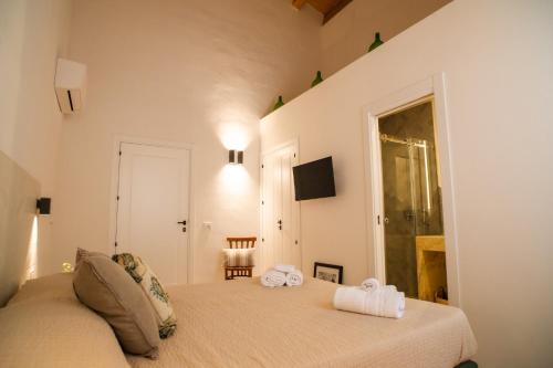 Katil atau katil-katil dalam bilik di Masseria Il Passo