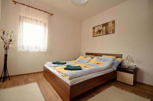 Postel nebo postele na pokoji v ubytování Hanság Vendégház