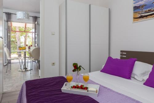 Ένα ή περισσότερα κρεβάτια σε δωμάτιο στο Apartments Babic