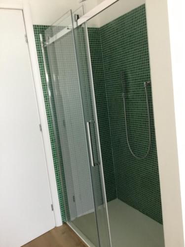 a shower with a glass door in a bathroom at Ca’ Uccelli-Stupendo Appartamento 5 min da Venezia in Marghera