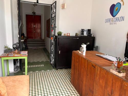 a entrance to a room with a door and a desk at Catre de mi corazón in Xalapa