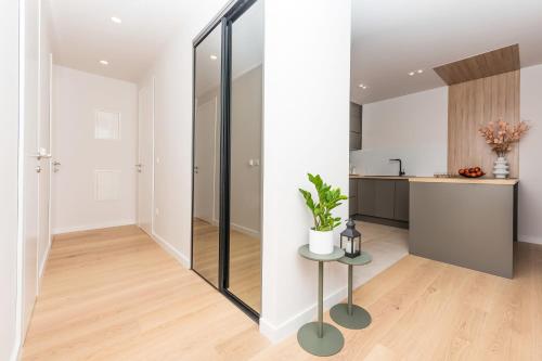 a kitchen and living room with a glass wall at Luxury apartment EL Paradiso Sea & City view in Makarska